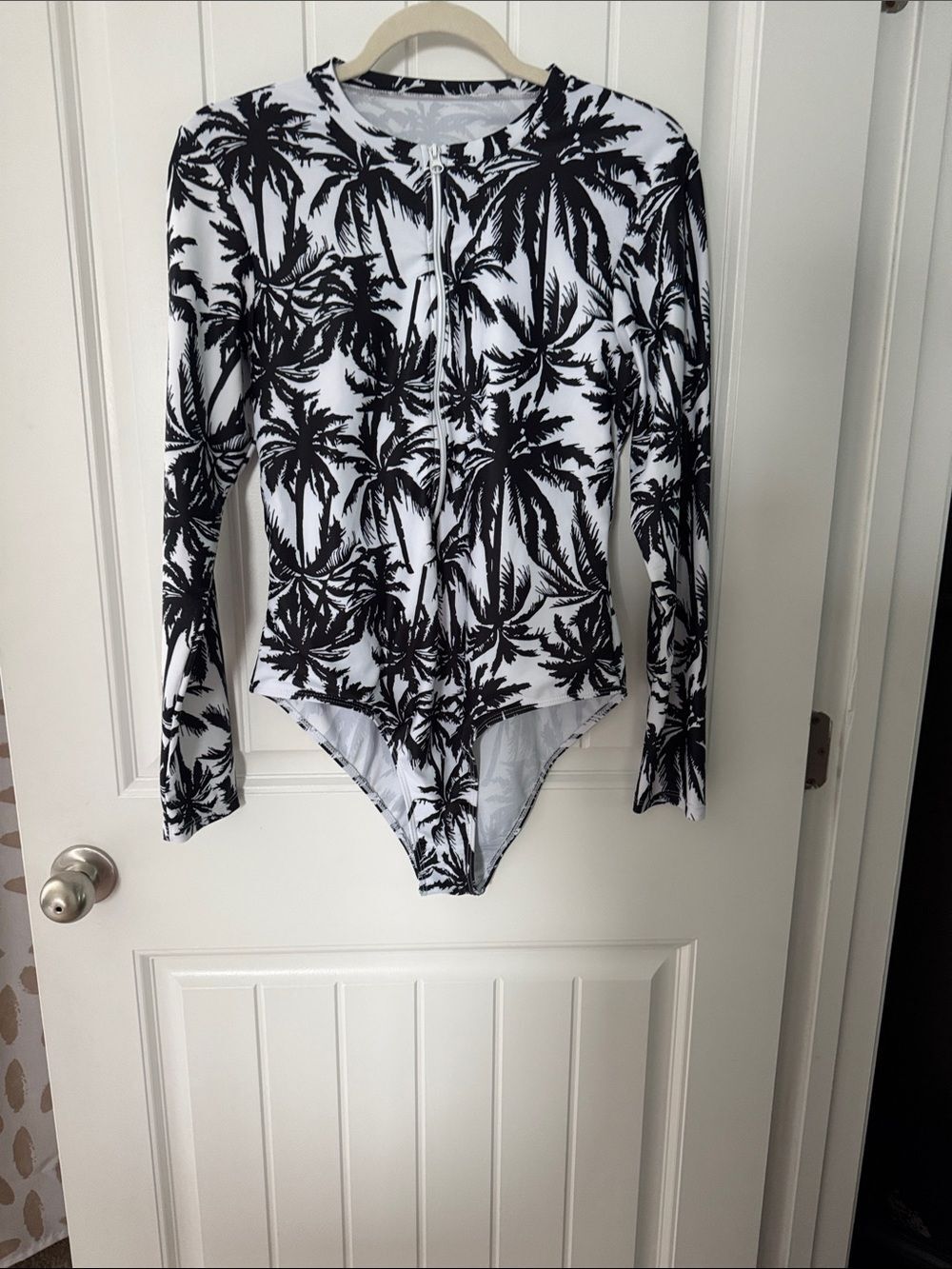 Long-Sleeve Black & White Palm One-Piece Swimsuit.